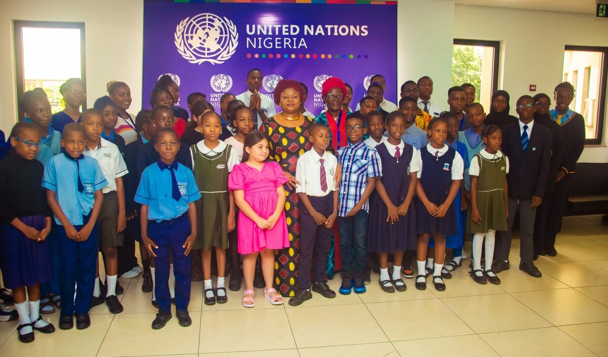 With schoolchildren at the United Nations Nigeria office